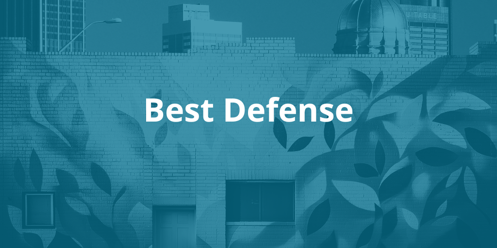 Building with leaf mural on it, a blue wash over it, and text reading "Best Defense"